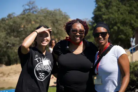 ELMSN students Michaela David and Cierra Jones with a Camp Superstar counselor