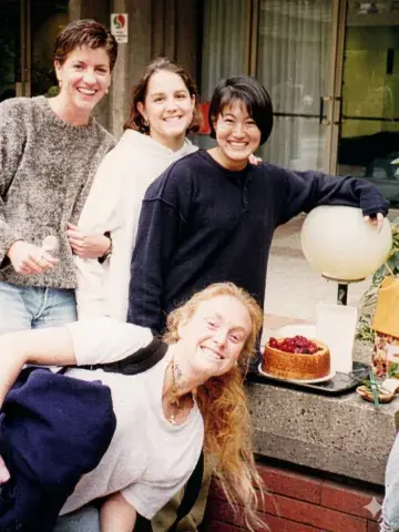 Four students and birthday cake