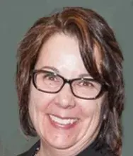 Headshot of woman with short dark hair