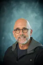 Headshot of man with glasses