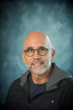 Headshot of man with glasses