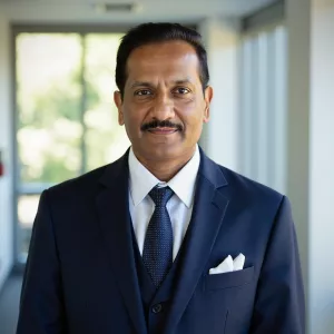 Man standing in a hallway wearing a business suit