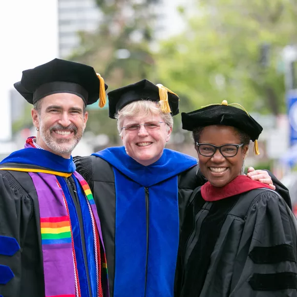 Staff and faculty at commencement 960x930