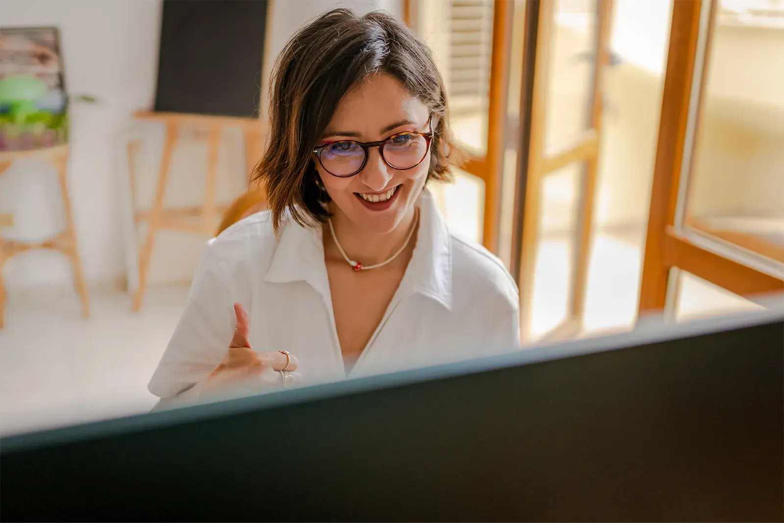 Woman talking to computer screen