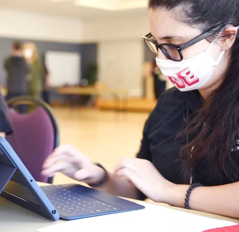 Student works with iPad.