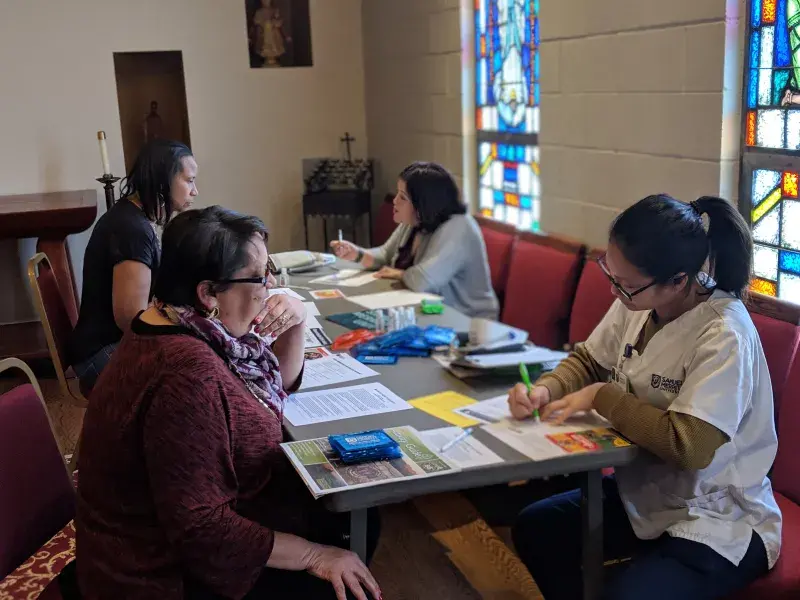 SMU student provides free blood pressure screening to community member