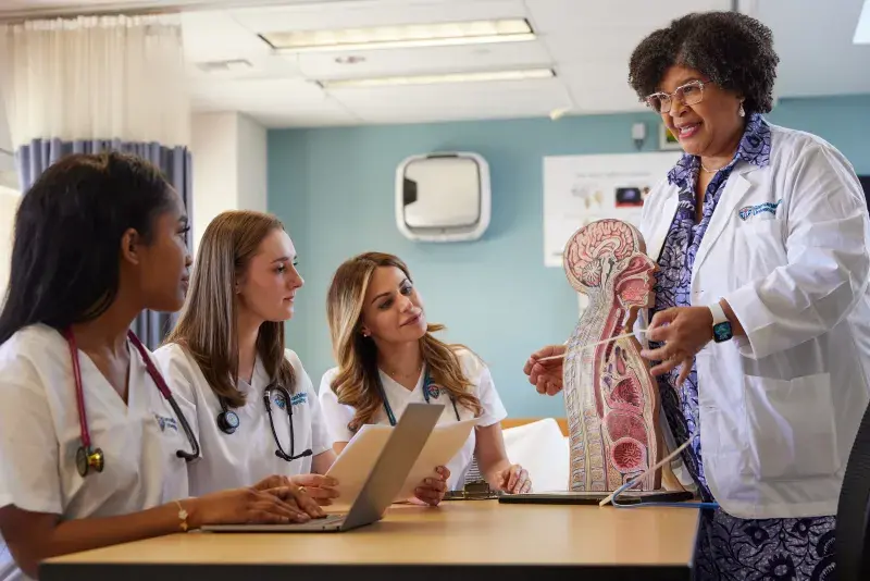 Dr. Carmen Sullivan teaching nursing students at SMU 