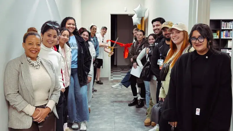 Faculty, staff and students gather at the entry of the student pantry in Fresno for the grand opening.