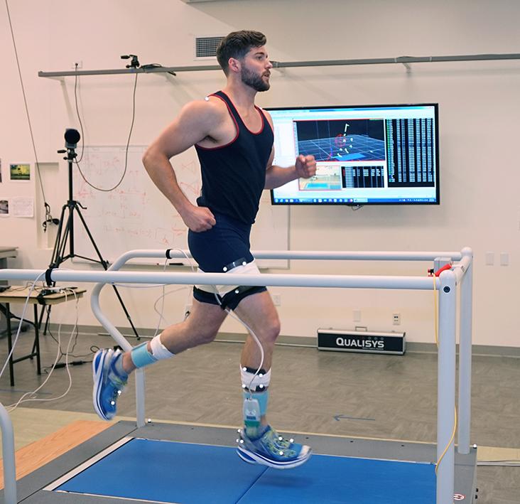 Student running on treadmill in Motion Analysis Research Center