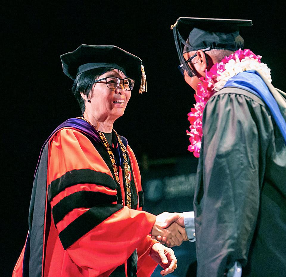 Ching-Hua Wang graduation handshake