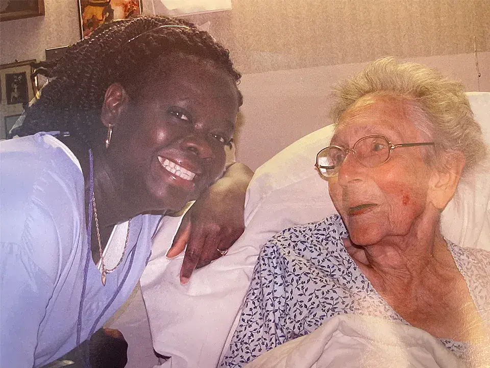 Florence Edwards (left) poses with one of the seniors she worked with.